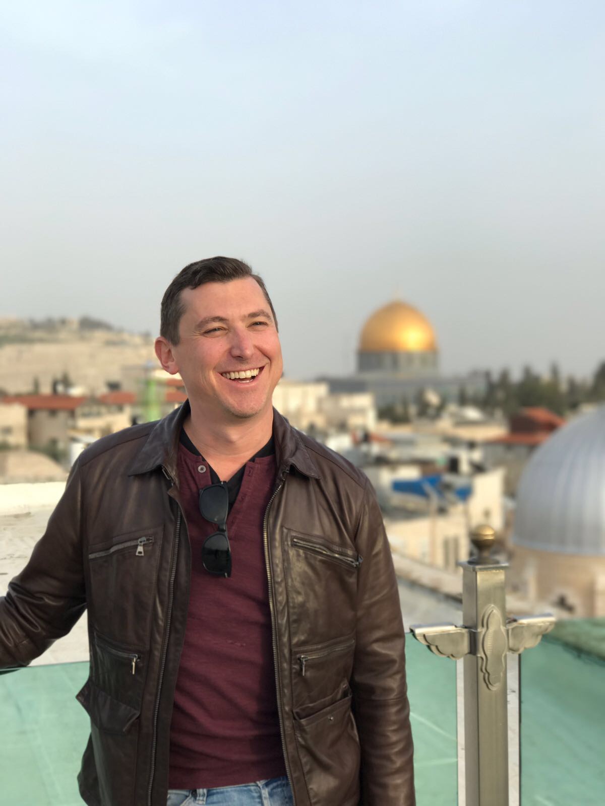 Person on rooftop above Jerusalem