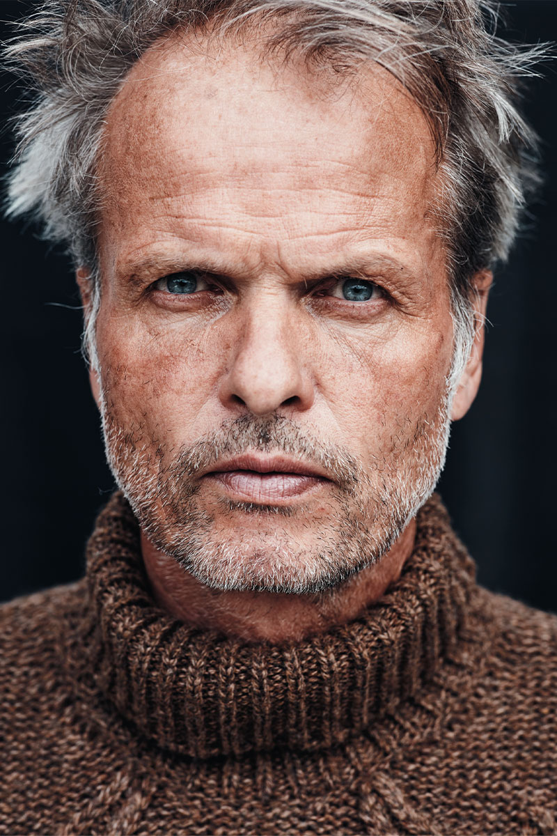 Portrait photo of explorer Erling Kagge, closeup, wearing brown fisherman's sweater